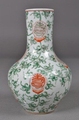 Chinese Green and White Vase with Red Chou: Bulbous porcelain vase with overall green enamelled tendrils and budding Chou or longevity symbols in iron red, two iron red concentric circles near bottom, 9.5" H x 6" Diameter. Private collection Ro