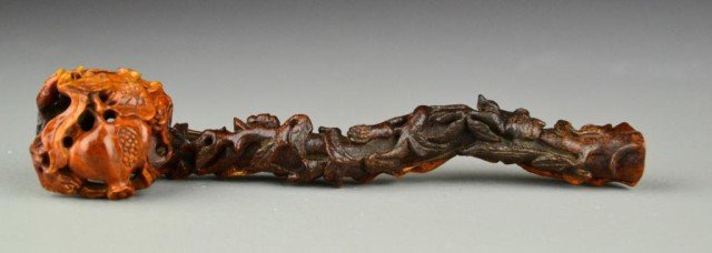 Chinese Carved Horn Ruyi Scepter: A finely carved and polished scepter of horn depicting climbing vines on stem and pomegranates on head, 7" H.