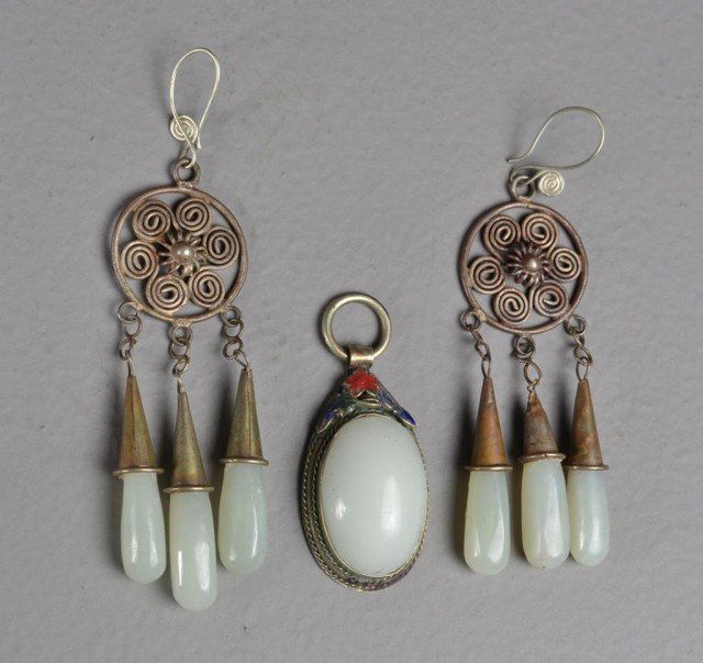 (3) Chinese White Jade Earrings and Pendant: Including large cabochon of white jade and silver oval (1.75" ) pendant with seal marks on back along with pair of pierced chandelier earrings of silver spirals and three oblong 1" drops of white poli