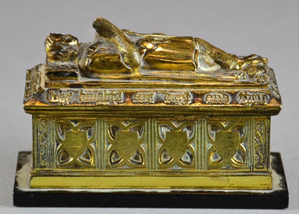 Brass Casket with Knight Figure: Small brass casket with knight on top holding a shield with rampant lion on it, circa early 20th century, 3" H x 4.75" L x 2" W, some wear to finish. Private collection White Lake, MI.