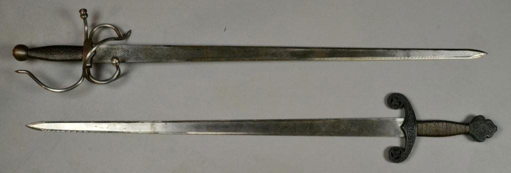 (2) Spanish Swords: To include one "El Cid" design with circular pommel and one "San Fernando" Style sword, both have engraved blade and wire-wrapped handle, marked 'Made in Spain' near hilt and 'Toledo' on reverse, larg