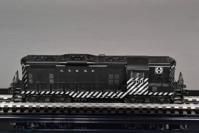LIONEL SANTA FE GP-7 DIESEL LOCOMOTIVE: GP-7 Diesel locomotive, Lionel Legacy Control System Equipped, Odyssey II Speed Control with On/Off Switch, Legacy Rail sounds, Two powerful maintenance free motors, directional lighting, electro coup