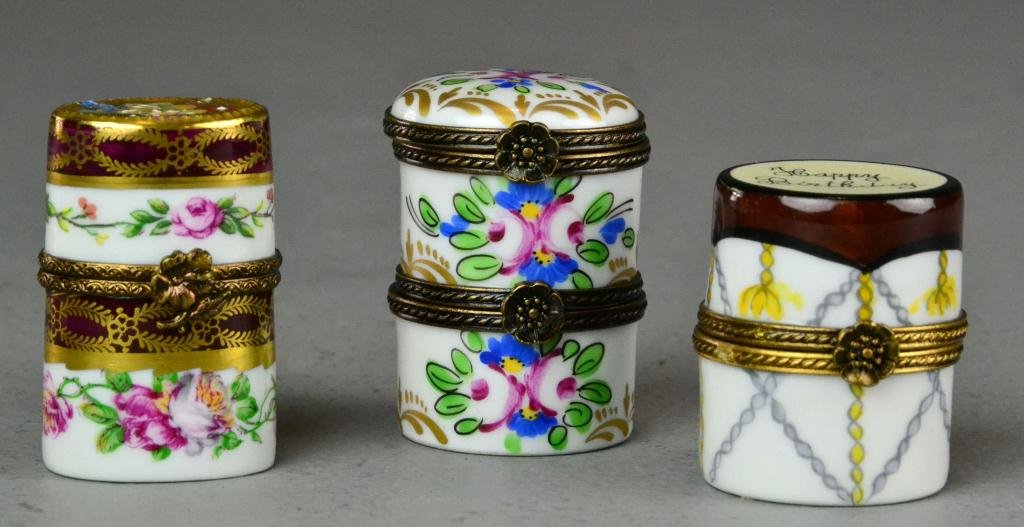 (3) Pcs. Limoge Pillboxes and Perfume Container: Including two hand painted porcelain pill boxes with floral and gilt decoration, one says 'Happy Birthday' along with similar porcelain container containing a glass perfume bottle, circa 20th century,