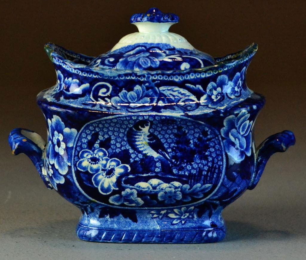 Blue Transferware Covered Sugar Bowl - Stone: A two handled sugar bowl and lid depicting bird and floral motif. 5.75" H to top of finial. Marked Stone China in underglaze blue with impressed number 18. Circa late 19th early 20th century, lid has