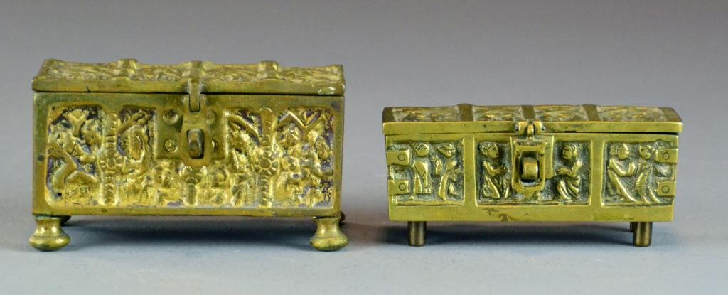 (2) German Brass Gothic Casket Boxes: To include two brass gothic casket boxes in bas relief with center latch and raised on four feet. Largest measures 5.5" L. Circa early 20th centruy.