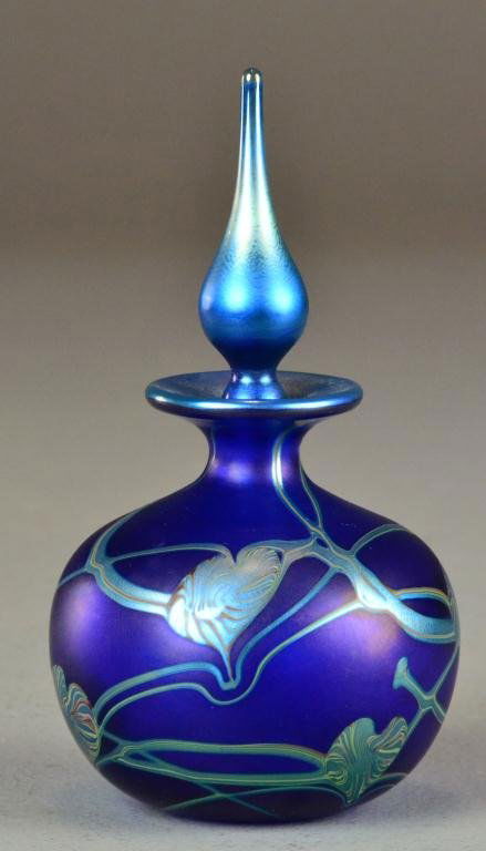 Indigo Art Nouveau Hand-Blown Scent Bottle: Consisting of a bulbous art glass scent bottle with flame-shaped stopper, signed on bottom 'Okra' 1990 BA-2 149, circa 20th century, 7.5" H, mint condition. Private collection Flint, MI.