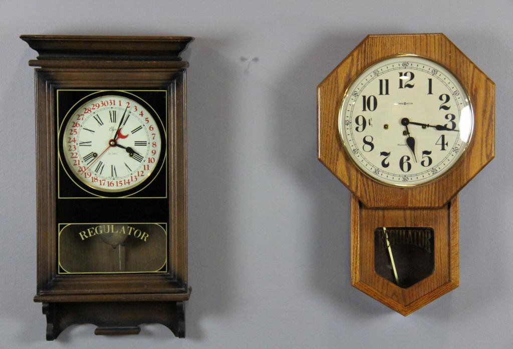 (2) Wall Clocks including Regulator: Consisting of a Howard Miller Regulator wall clock in oak, and an Elgin 31-day Regular wall clock, circa mid-20th century, largest is 25.5" H, condition varies.