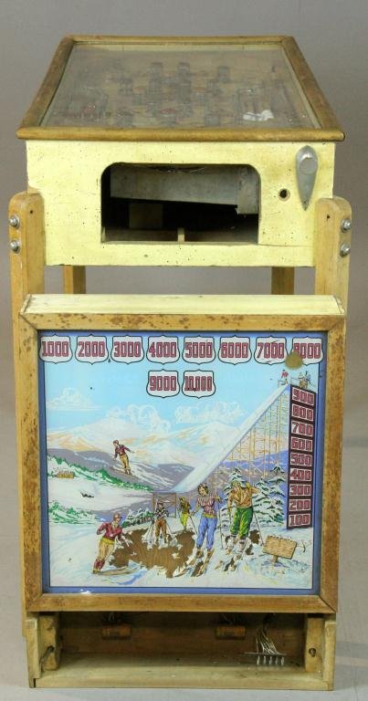 Antique Genco Pinball Machine: A patented October 1937, "Ski-Hi" (IPD No. 2173), nice illustrations of prewar era skiers, with metal balls, unit is 44" L x 22" W x 11" W, wooden legs with metal foot pads are 35" L, the glass back i