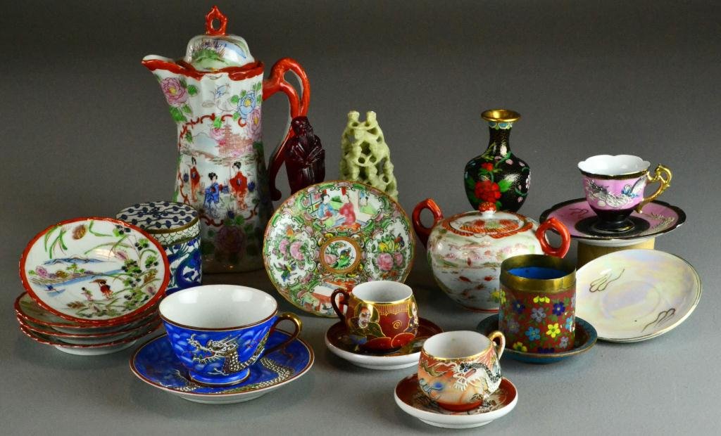 (23) Pieces Chinese & Japanese Decorative Arts: To include porcelain teapots, cups, and saucers, cloissone, and soapstone, largest is 10". Circa late 19th early 20th century.
