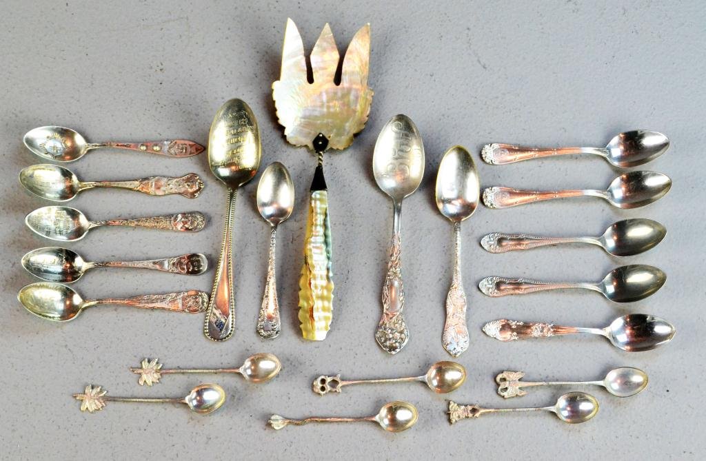 (21) Pcs. Silverplated Silverware: To include very nice MOP mounted serving fork stamped EHLH possibly sterling, together with silver souvenir spoons and teaspoons, all circa 20th century. Provenance: private collection of the late Wm.