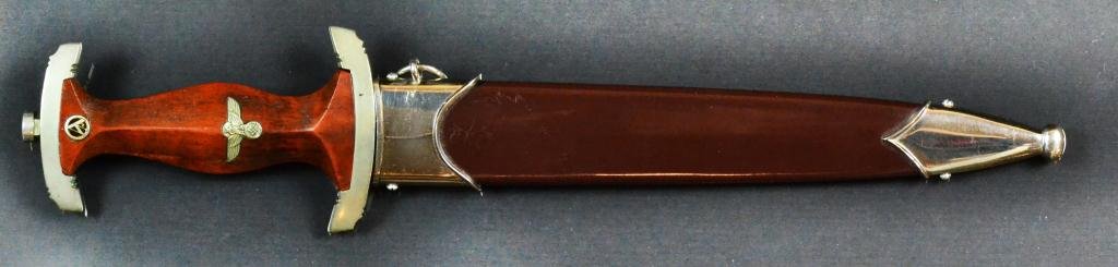 Original 1933 Pattern Nazi Sa Dagger & Scabbard: The maker "August Bickel was a primary edged weapon contractor to the Third Reich during the 1930's. Blade marked "Alles fur Deutschland", the daggers cross guard with impressed letters "Er", blade in