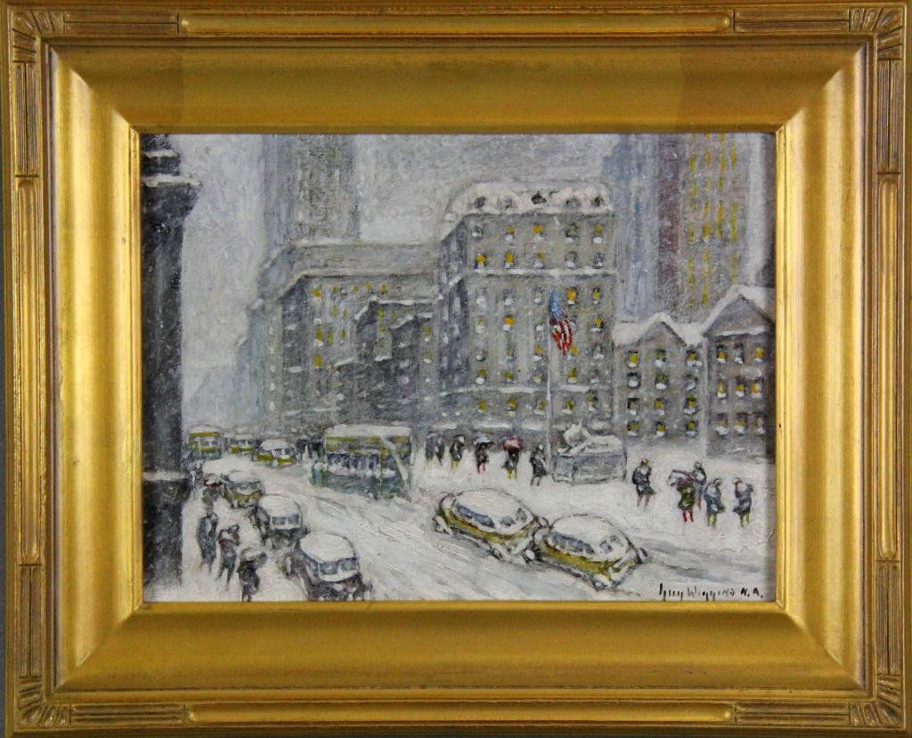Guy Carleton Wiggins Oil Painting on Board: Titled "5th Avenue Storm" depicting an urban New York winter scene with figures,vehicles, and an American flag, signed lower right and signed and titled en verso. Guy Carleton Wiggins (1883 - 1962) wa