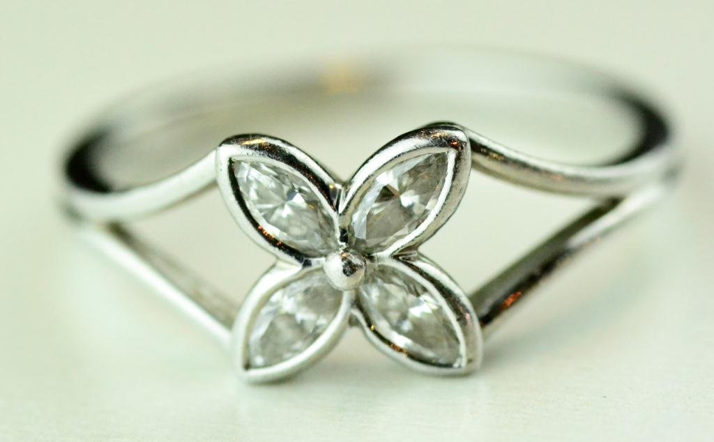 Tiffany Diamond And Platinum Ring: The mount formed as a four leaf clover, each clover set with a marquis-cut diamond, stamped 1997 Tiffany & Co., pt 950, with Tiffany pouch. Size 6.5, good condition.