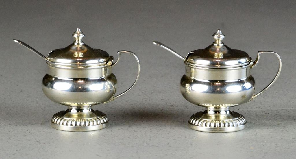 Pair Birks Sterling Mustard Pots and Spoons: Each with beaded footring and Federal style handles, each with matching spoon, marked Birks Sterling, 2.75" H, 4 ounce total weight, circa early 20th century. Provenance: private collection of the lat