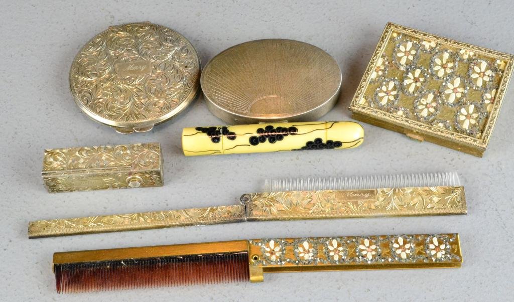 (4) Sterling Makeup Articles: To inlcude compacts, lipstick holder, folding comb together with two inlaid brass makeup items; comb and compact together with celluloid cased manicure set, silver weights 8 ounces total weight, all c