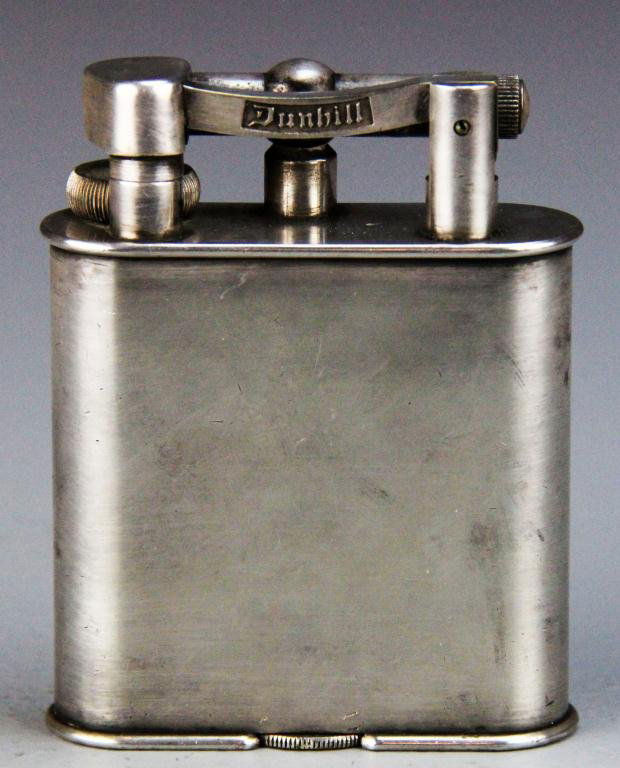 Antique Dunhill's Oversized Art Deco Cigar Lighter: Consisting of large lift-arm lighter, 4.25" H x 3.25" W x 1.125" D, circa early 20th century, some surface wear but general good condition.