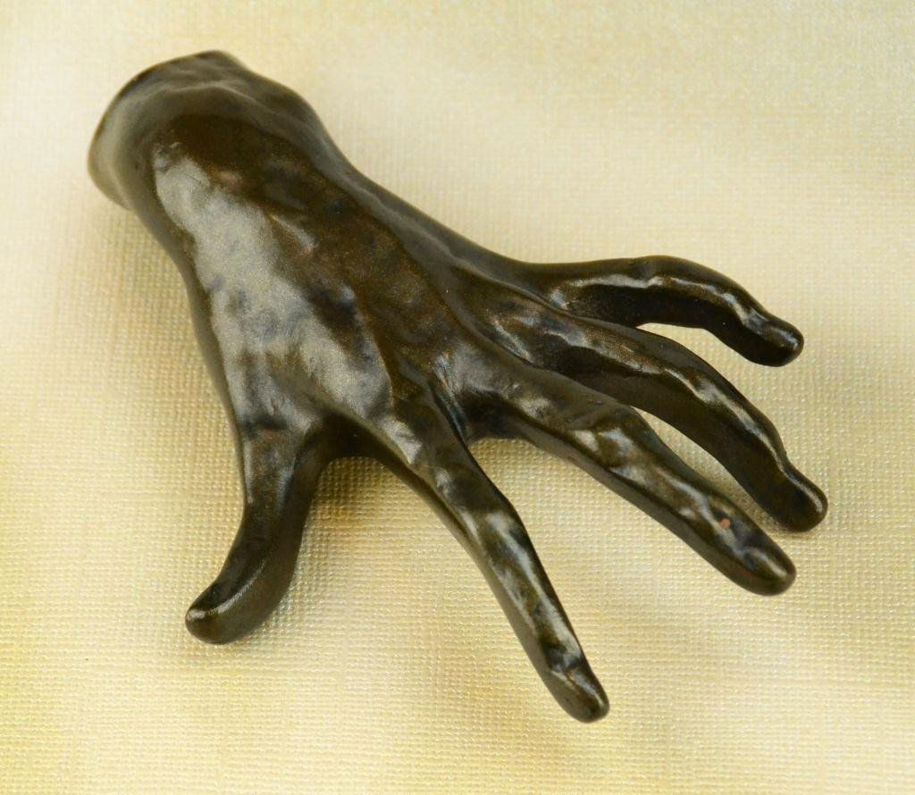 After Auguste Rodin Bronze: "One hand" with brown patina. Auguste Rodin (1870-1917) France : known for his realistic figural sculptures in bronze; unsigned; 4.875"Long; circa 20th century. Private collection Hadley Michigan.