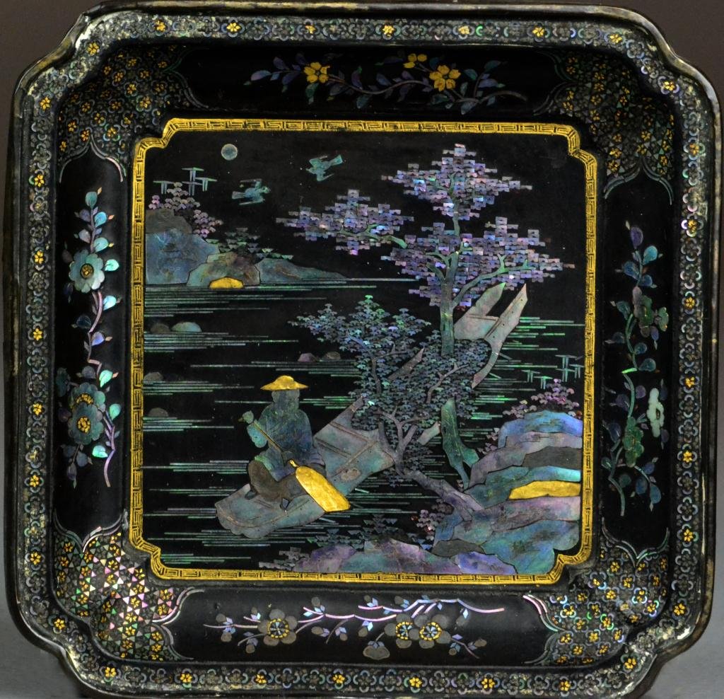 A Fine Vietnamese MOP Inlaid Lacquer Tray Signed: Finely inlaid to depict a fisherman in boat under an ancient pine tree, the sides depicting lotus, with areas highlighted in gilt, with inlaid signiature and possibly a poem in MOP to the back, 4.5" s