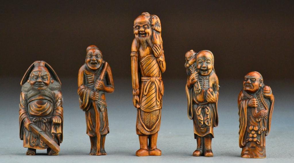 (5) Japanese Meji Period Carved Netsuke: To include five large netsuke carved boxwood elders, each finely carved to depict a different elders, with great attention to detail, all bearing two character signature to base, tallest is 5"H. Prope