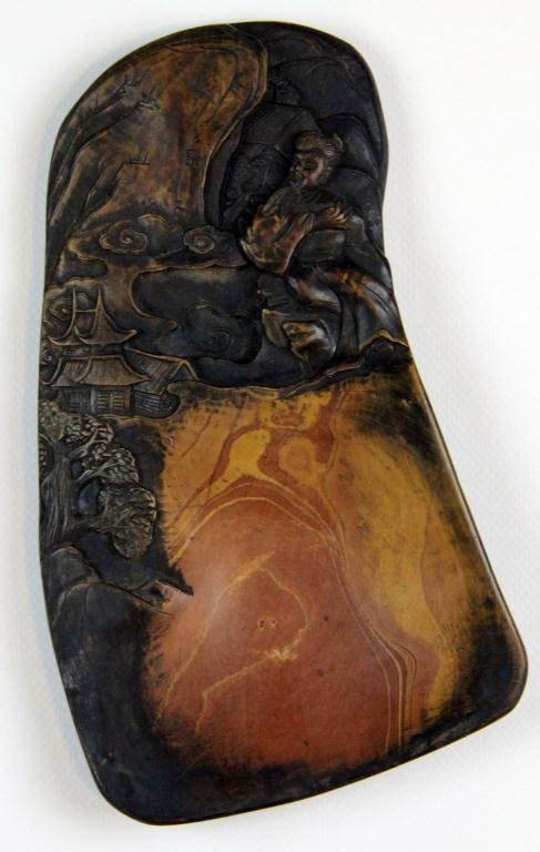 A Fine Chinese Republic Period Inkstone: Carved to depict a figure on a mountain looking downward at a village, the reverse with calligraphy and sealmakrs, dated to the fourth year of the Republic, exquisitely rendered, measuring 9.625" L x 