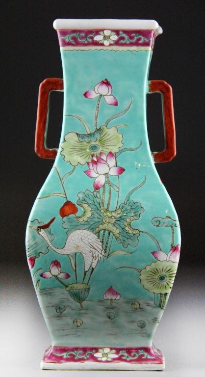 Chinese Famille Rose Porceling Hu Vase: Finely enamelled to depict cranes amongst foliage against a turquoise ground, with two square handles, with impressed China mark to base and remnants of an old paper label, 12" H, circa late 19th-earl