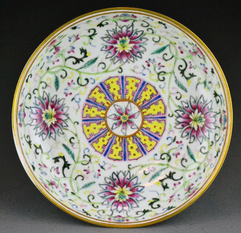 Chinese Qing Famille Rose Porcelain Bowl: Depicting lotus blossoms, tendrils and bats, six character marked for Great Qing Qianlong Production in underglaze red, 8.125" diameter x 1.125"H, circa 19th century. Important West Bloomfield Michiga