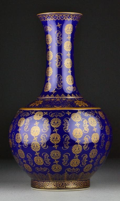 Chinese Qing Blue And Gilt Decorated Porcelain Vas: Depicting bats and symbols in gilt against a cobalt ground, six character marked within a gilt reserve, 15.5"H, circa 19th century. Condition with damage and restoration. Important West Bloomfield Mic
