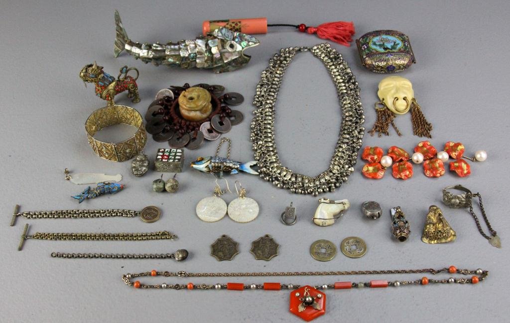 (26) Pcs. Chinese Jewelry Incl. Joseff of Hollywoo: Consisting of a MOP jointed fish, 2 smaller enamelled jointed fish, cloisonne & MOP earrings, hardstone netsuke, a filigree silver bracelet, a Joseff of Hollywood bakelite and copper broach depicting 