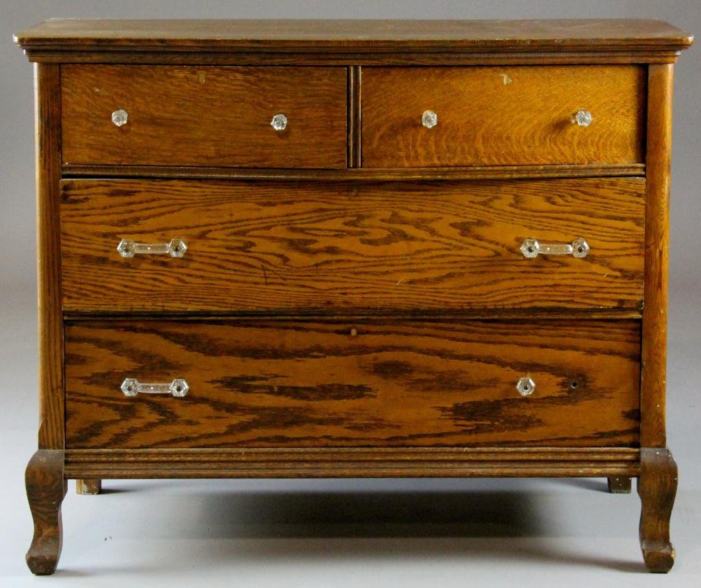 American Tiger Oak 5-Drawer Dresser: Having three side panels, glass drawer pulls and ogee feet, 33.5" H x 41.25" W x 22" D, circa 20th century, condition commensurate with age. Private collection, Rochester, Michigan.