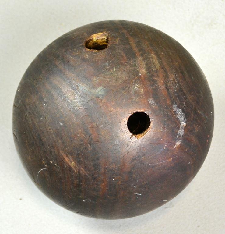 Antique Hand-Carved Lignum Vitae Bowling Ball: Hardwood with two finger holes, 8" Diameter, circa late 19th century, good condition. Private collection, Rochester, Michigan.