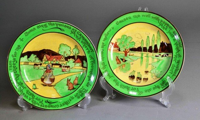 (2)" YE OLDE ENGLISH" POLYCHROME WHIMSY PLATESTwo : Two similar ceramic plates with old English colored landscapes, surrounded with sayings on bright green border, "Some sing the praises of Camembert…" and " Season Me Well with Pepper and Salt...," m