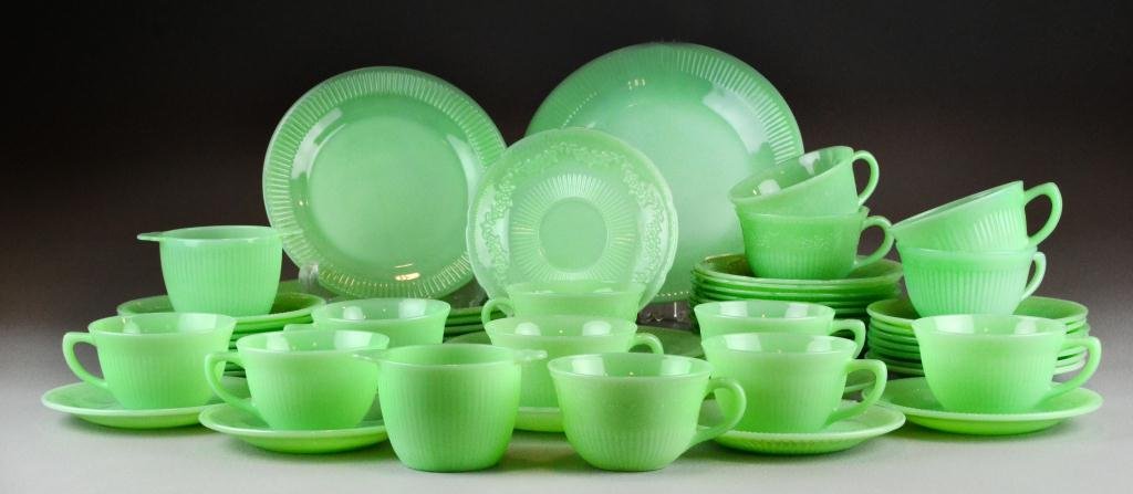 (55) Pcs. Jadeite Glass: To include Fire King ware and Anchor Hocking dinnerware: 5 plates, 3 salads, 13 cups, 2 sugars, 33 saucers, circa mid-20th century, few having minor chips and light surface wear. Collection of Oxford,