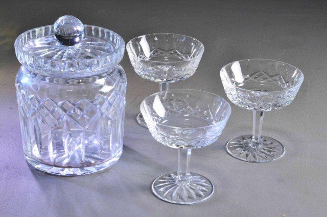 (4) PCS. WATERFORD GLASSES & BISQUIT BARREL: Including a round cut glass covered bisquit barrel 7" h. along with three Waterford cut glass sherbet/champagne glasses, each 4.25" h., all excellent condition. Private collection Metamora, MI.