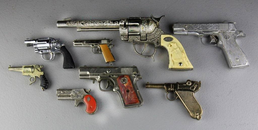 (8) Antique Toy Guns: To include 8 guns of various sizes, the largest at 11" L is a Gene Autry cap gun, also to include a Luger, a Derringer, two 45 pistols, etc. All the toys are in good condition and without rust. Circa