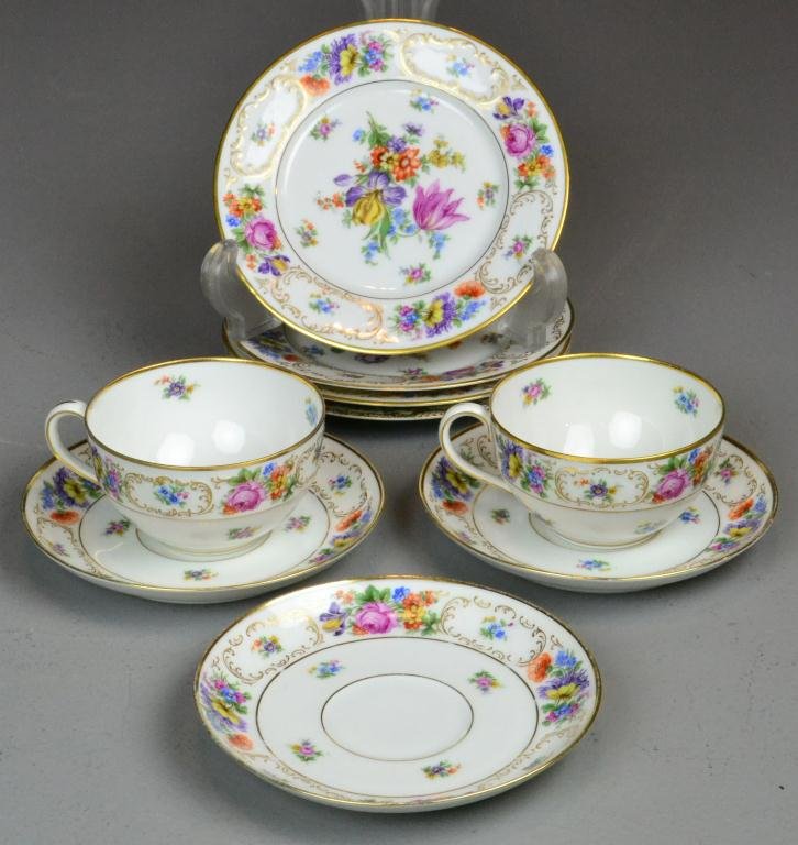 (9) Bavarian Dresden Porcelain Cups & Saucers: Beautiful floral and gold Dresden Bavaria Tirschenreuth porcelain assortment, two cups, three saucers, three matching dessert plates and one similar dessert plate, marked on bottom with shield surroun
