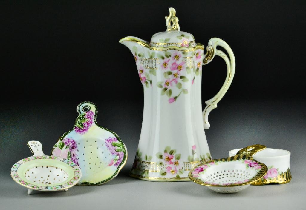(8) Pc. Miscellaneous Porcelain: To include a hand-painted Nippon coffe pot with floral and gilt decoration, 3 porcelain tea strainers with pierced decorative strainers and drip cups, a Bristol glass enamelled and gilt egg with flora