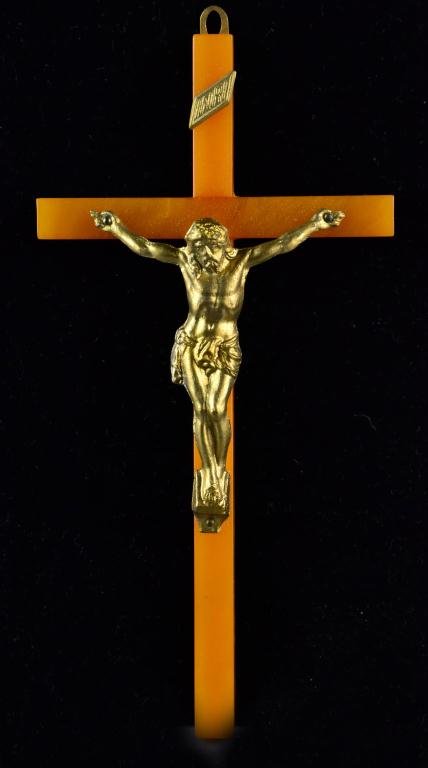 Butterscotch Bakelite Crucifix: Having brass body of Christ, fitted for wall hanging, 6.75 L, circa mid-20th century. Condition: excellent. Provenance: property of a Flint MI lady.