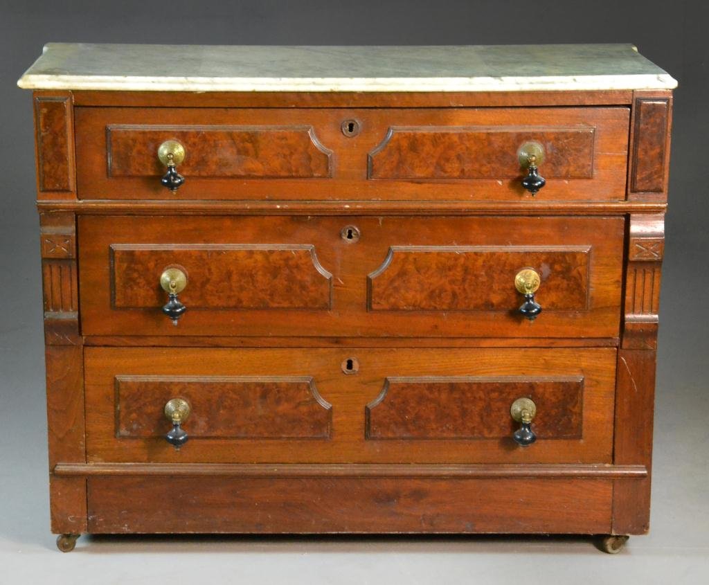 Eastlake Mahogany Dresser with Marble Top: White marble ogee top over four drawers with ceramic and brass pulls, circa early 20th century, 40" H x 32" L x 17" D, good condition. Property of David and Carol Walker, Sterling Heights, Michigan.