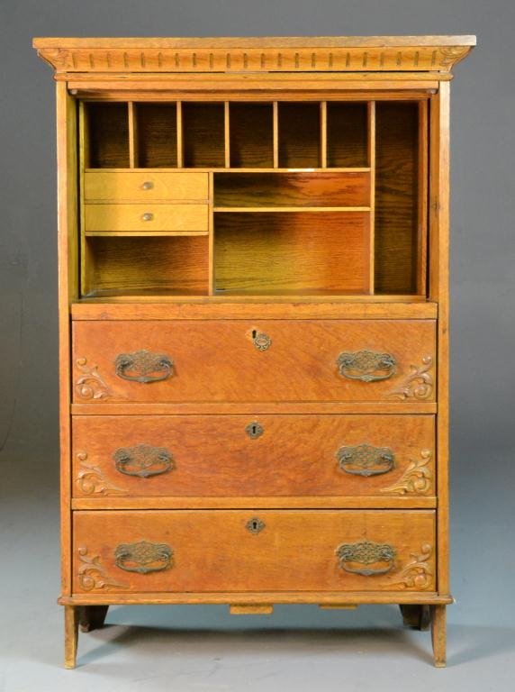 Antique Oak Secretary: Rectangular cornice with dentil-style molding, above open interior with pigeon holes and two drawers above three drawers, raised on four straight legs, with original escutceon & pulls, 43" H x 33.5" W
