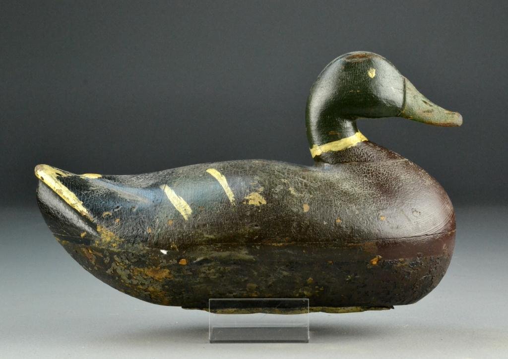 Mallard Drake Hollow Duck Decoy: Having painted eyes, weight to bottom, appears to have original paint with nice patina, 13.5" L, circa 1900, wear commensurate with age. Provenance: From The Estate of The Late James W. Goodrich of Mi