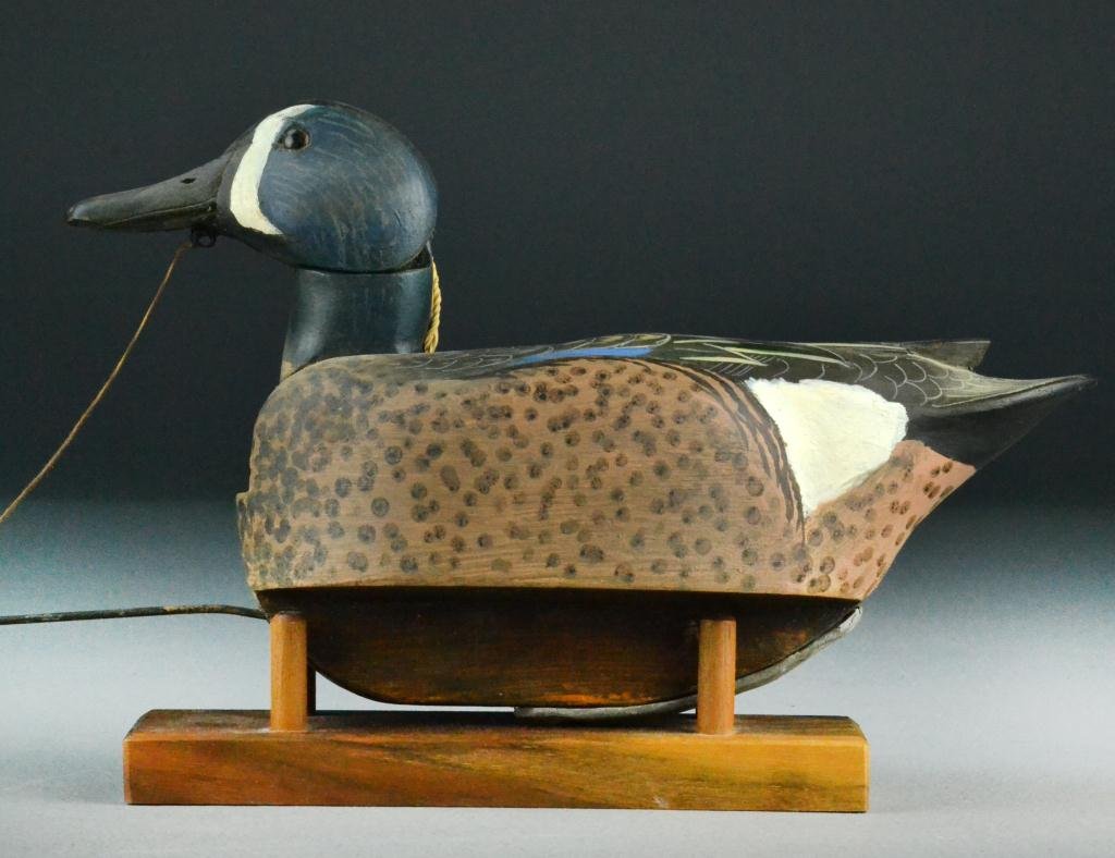 Woodson Roddy Duck Decoy with Leader: Finely painted with glass eyes, wooden keel and weight, marked No. 1 Feeder, head is attached to string and mimics feeding, signed to bottom 'Woodson Roddy, Clinton MO' on dated 1987, 12" L, good cond