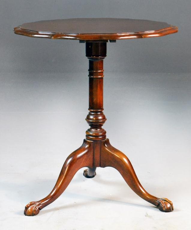 Mahogany Piecrust Table: Scalloped top tilts, turned pedestal raised on three splayed claw & ball feet, 27" H x 24" Diameter, circa 20th century, minor nicks and scuffs to top otherwise good condition. Estate of Cecelia Wolfe