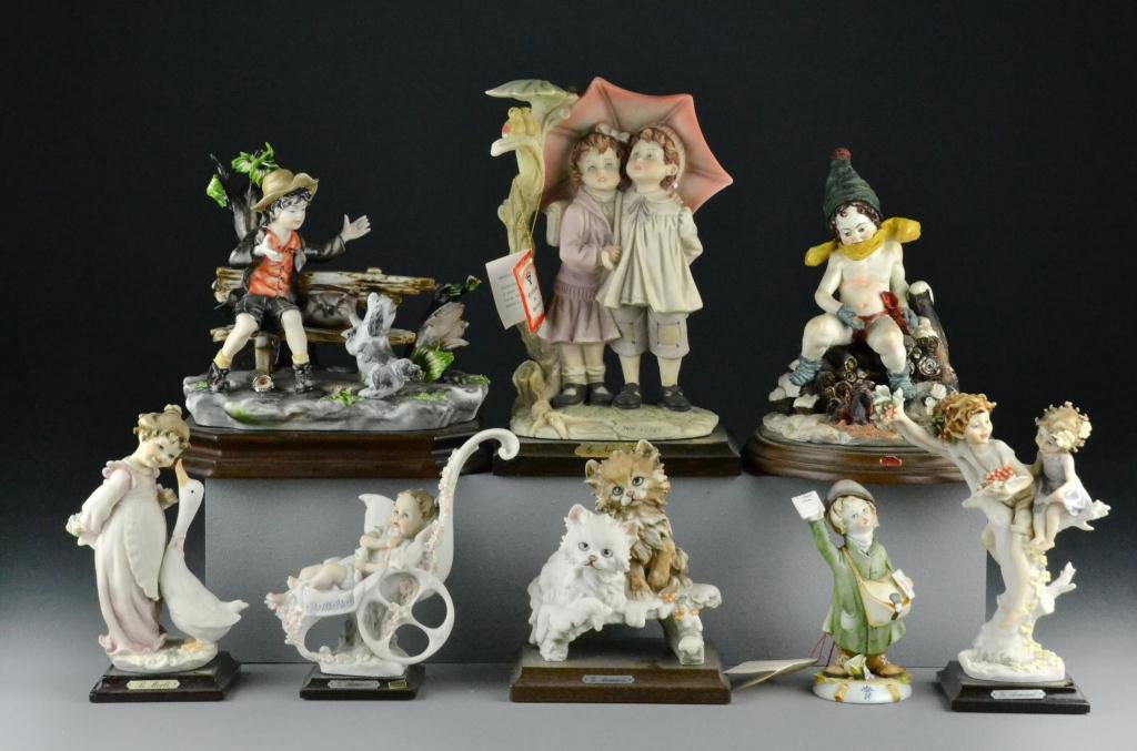 (8) Armani & Sartori Capodimonte Figures: Depicting poor boy on bench with door, newspaper boy, kittens, babies and more, N marks to bottom in blue , circa 20th century, largest is 9" H, condition varies. Estate of Cecelia Wolfe-Penny, Flint,