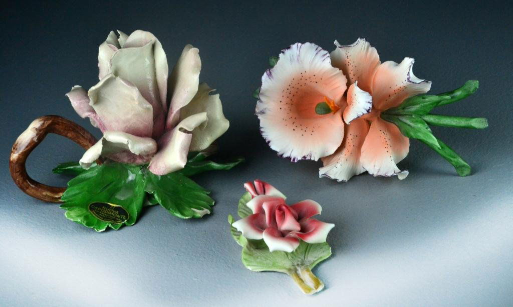 (3) Capodimonte Porcelain Flowers: To include a large pink rose, a tiger lily and a smaller red rose, largest is 5" H, circa 20th century, with tags, excellent condition, no chips or cracks. Estate of Eugenia Sager, Plymouth, Michigan.