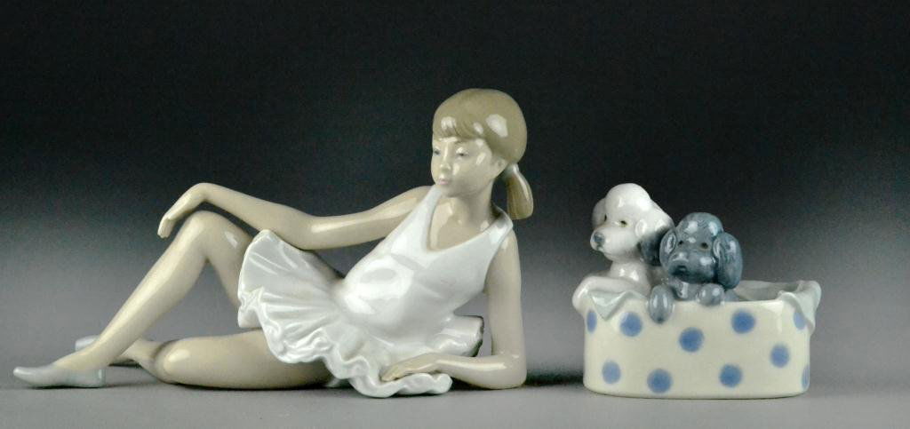 (2) Lladro NAO Figures: Depicting a reclining ballerina and two puppies in a spotted basket. Largest is 8" L, circa 20th century, excellent condition. Private collection of a Fairview Park, Ohio Lady.