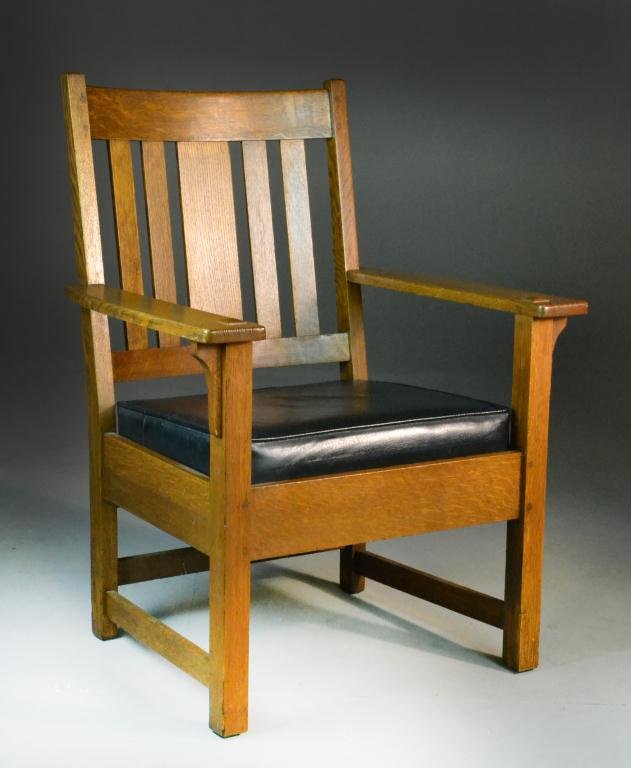 Limbert Arts & Craft Oak Armchair: Five-slat back, burned-in-brand Limbert mark under armrest, #545 stenciled to bottom back, 35" H x 27" W x 22" D, circa early 20th century, repair to front right leg, otherwise good condition. Propert