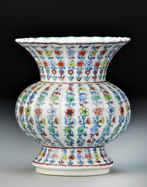 Chinese Doucai Painted Porcelain Vase: The scalloped vase of spittoon shape, finely painted to depict lotus blossoms and scrolling tendrils, raised on short foot ring, the base bearing six character Chenghua mark within two concentric circ