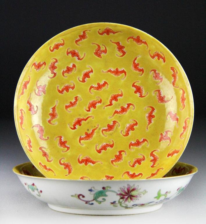 Pr. Chinese Porcelain "100 Bats" Bowls: The interior decorated with iron red bats against an egg yolk yellow ground, the exterior with lotus blossoms and tendrils, raised up on short foot rim bearing six character mark in underglaze red, 1.