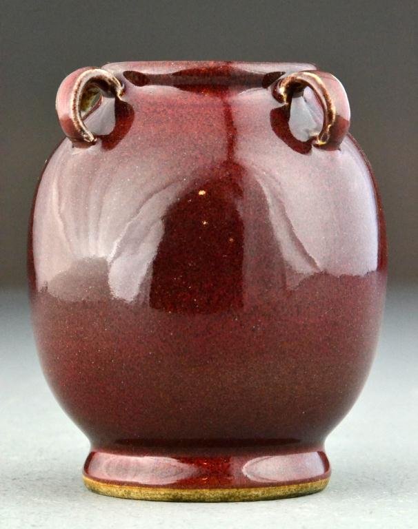 Chinese Qing Sang De Boeuf Porcelain Vase: With four raised handles, 5"H, circa late 19th/early 20th century. Important West Bloomfield Michigan Collection.