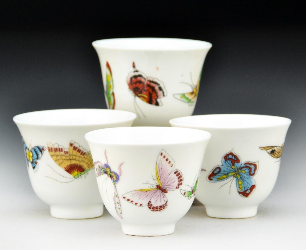 (4) Chinese Famille Rose Porcelain Tea Cups: Finely painted to depict butterflies and moths, raised on short foot ring, the base bearing a red leaf, 2"H X 2.5"D. Private collection Rochester Hills Michigan.